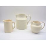 A large white ceramic jug, marked 'E II R, 1953, ADAMS', along with two others similar.