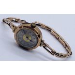 A Victorian 9ct gold watch on 9ct strap- total weight including movement 19g
