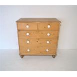 A Victorian pine chest of five drawers, with ceramic handles, length 106cm, height 105.5cm, depth
