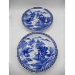 A pair of 20th century blue & white Oriental chargers with embossed stamp mark to reverse