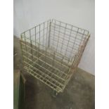 A vintage industrial wire work basket