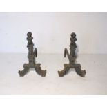 A pair of cast iron fire dogs.