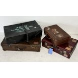 A collection of vintage suitcases with numerous labels