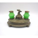 A metal inkwell stand, with two green glass inkwells.