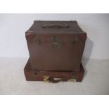 A vintage suitcase with Southern Railway label along with a hat box