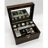 A mahogany dressing box with secret drawer containing various silver plated dressing pots,