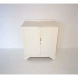 A white painted cupboard, with two shelves, length 73cm, height 82cm, depth 46.5cm.