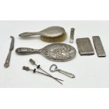A collection of silver dressing table items including a mirror along with a 925 silver atomiser,