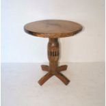 An antique circular occasional table, the base formed from a capstan, approximate diameter 68cm,