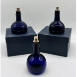 Three Bristol Blue glass onion shaped decanters (signed to base) two in boxes and all with