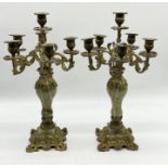 A pair of onyx and gilt metal six branch candelabra