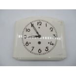 A vintage wall hanging ceramic kitchen clock