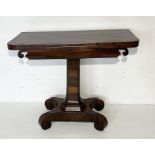 A William IV rosewood games table, with scroll detailing.