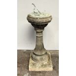 A weathered reconstituted stone garden sundial - Height 81cm