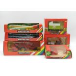 Six Britains boxed farm machinery models, comprising of MF Combine Harvester (9570), Log Transporter