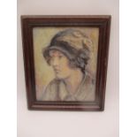 A framed oil on canvas painting of a wistful lady, possibly circa 1940s
