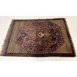 A large red ground Iranian handmade rug 190 x 136cm