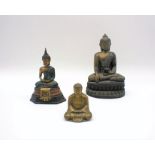 Three Buddha figures.