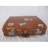 A vintage Legge suitcase with travel labels circa 1968