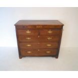 A Georgian mahogany chest of five drawers, with inlaid shell detailing, raised on bracket feet,