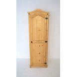 A pine single wardrobe, length 57cm, height 178cm, depth 50cm.