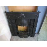 An Art Nouveau style cast iron fire surround, length 91cm, height 103cm.