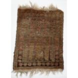 A small Eastern red ground rug 58cm x 46cm