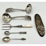 A silver plated muffin fork with mother of pearl handle, 2 silver spoons and two ladles etc.