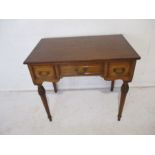 A turn of the century hall table with three drawers, length 84cm, height 76cm.