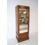 An Edwardian inlaid mahogany single wardrobe, with mirrored door and single drawer below, length