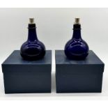 Two boxed Bristol Blue glass onion shaped decanters (signed to base) with hallmarked silver stoppers