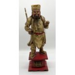 A Chinese carved giltwood standing figure (possibly Guan Yu) with horse hair beard on red painted