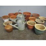 Thirteen garden pots including glazed and terracotta plus two galvanised watering cans.