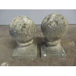 A pair of stone ball finials, height 34cm