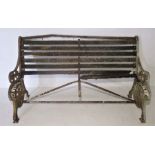 A turn of the century weathered bench with cast iron frame. Frame is marked Aldershot U. D.