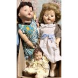 Two large vintage dolls and one smaller example