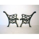 A pair of painted cast iron garden bench ends.