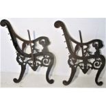 A pair of Iron bench ends