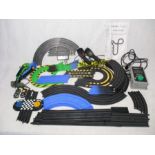 An unboxed Hornby Micro Scalextric set including two cars, two controllers, track, instruction