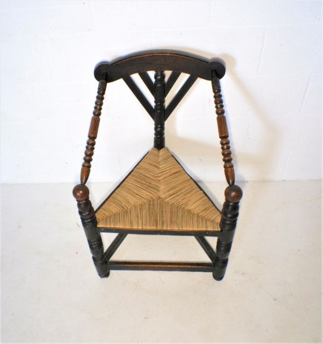 A Liberty style oak corner chair with rush seat. - Image 4 of 5