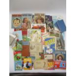 A collection of ephemera including vintage photo sets, I-spy books, mother and home magazines,