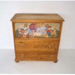A pine chest of three drawers, the top drawer painted with teddy bears, length 85cm, height 88cm.