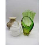 A collection of four art glass vases