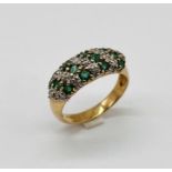 A 9ct gold emerald and diamond dress ring