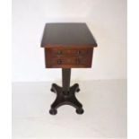 A Victorian mahogany work table, with two drawers and faux drawers on back, raised on an octagonal