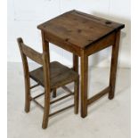 A small pine child's desk and matching chair