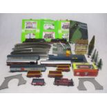 A collection of OO gauge model railway items including a Hornby LMS locomotive, carriages, two model