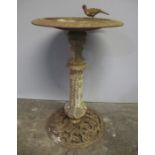 A cast iron bird bath. Approximate height 85cm