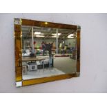 An Art Deco mirror - height 45cm, width 53cm