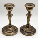 A pair of hallmarked silver candlesticks, height 14cm